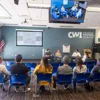 Students, faculty, staff, and more participate in a showcase of student presentations and art.