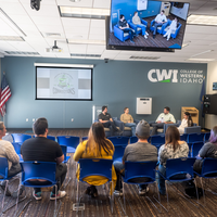 Students, faculty, staff, and more participate in a showcase of student presentations and art.