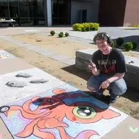 Students, faculty, staff, and more participate in a showcase of student presentations and art.