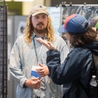 Students, faculty, staff, and more participate in a showcase of student presentations and art.