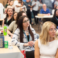 Students, faculty, staff, and more participate in a showcase of student presentations and art.