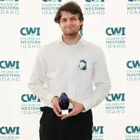 Attendees enjoy and celebrate the achievements of students at a college awards banquet.