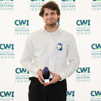 Attendees enjoy and celebrate the achievements of students at a college awards banquet.
