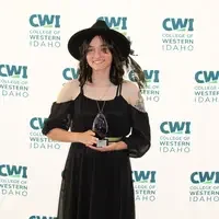 Attendees enjoy and celebrate the achievements of students at a college awards banquet.