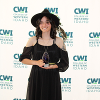 Attendees enjoy and celebrate the achievements of students at a college awards banquet.