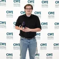 Attendees enjoy and celebrate the achievements of students at a college awards banquet.