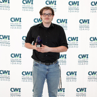 Attendees enjoy and celebrate the achievements of students at a college awards banquet.