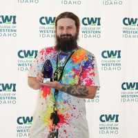 Attendees enjoy and celebrate the achievements of students at a college awards banquet.