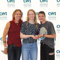 Attendees enjoy and celebrate the achievements of students at a college awards banquet.