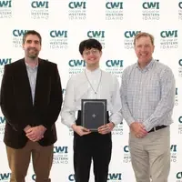 Attendees enjoy and celebrate the achievements of students at a college awards banquet.