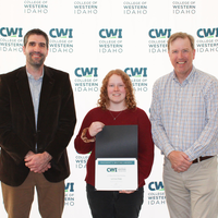 Attendees enjoy and celebrate the achievements of students at a college awards banquet.
