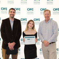 Attendees enjoy and celebrate the achievements of students at a college awards banquet.