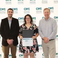 Attendees enjoy and celebrate the achievements of students at a college awards banquet.