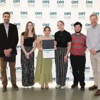 Attendees enjoy and celebrate the achievements of students at a college awards banquet.