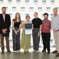 Attendees enjoy and celebrate the achievements of students at a college awards banquet.