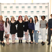 Attendees enjoy and celebrate the achievements of students at a college awards banquet.