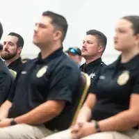 Photos from a graduation ceremony for Law Enforcement officers. 