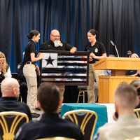 Photos from a graduation ceremony for Law Enforcement officers. 