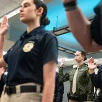 Photos from a graduation ceremony for Law Enforcement officers. 