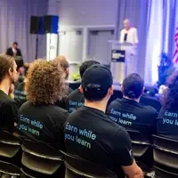 An apprenticeship graduation and signing event