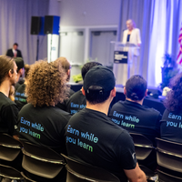 An apprenticeship graduation and signing event