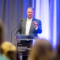 An apprenticeship graduation and signing event