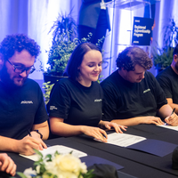 An apprenticeship graduation and signing event