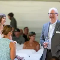 Faculty and staff from a college attend and annual event.