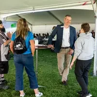 Faculty and staff from a college attend and annual event.