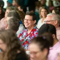 Faculty and staff from a college attend and annual event.