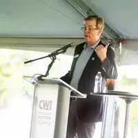 Faculty and staff from a college attend and annual event.