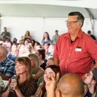 Faculty and staff from a college attend and annual event.