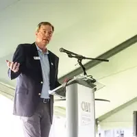 Faculty and staff from a college attend and annual event.