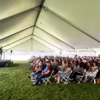 Faculty and staff from a college attend and annual event.