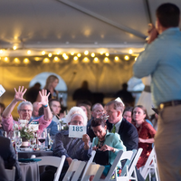 People bid at an auction.