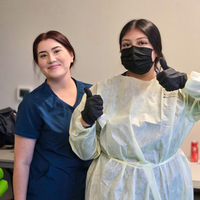 Photographs showing students and others volunteering services in the community.