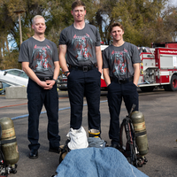 Student firefighters and CWI officials at a Fire Service Technology program press event announcing a $75k grant from Metallica.