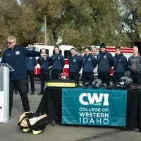 Student firefighters and CWI officials at a Fire Service Technology program press event announcing a $75k grant from Metallica.
