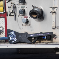 Student firefighters and CWI officials at a Fire Service Technology program press event announcing a $75k grant from Metallica.