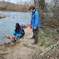 Volunteers working alongside trail and river