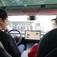 Students test driving Tesla