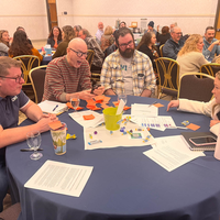 Guests attend a faculty professional development event. 