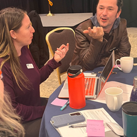 Guests attend a faculty professional development event. 