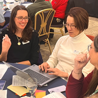 Guests attend a faculty professional development event. 