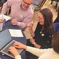 Guests attend a faculty professional development event. 