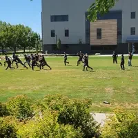 Group of people paying tag outside