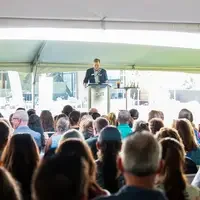 Faculty and staff from a college attend and annual event.