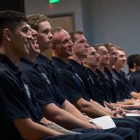Students listening and laughing