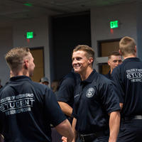 Graduates congratulating one another