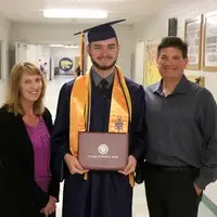 Idaho City High School senior, Jason Carignan poses with his parents Laura and Marc. 